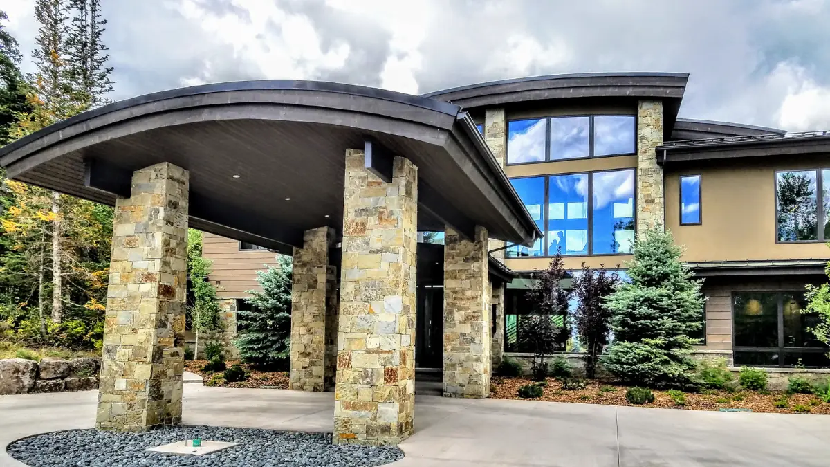 Custom estate home entrance at The Colony at White Pine Canyon, ski-in/ski-out community at Canyons Village Park City