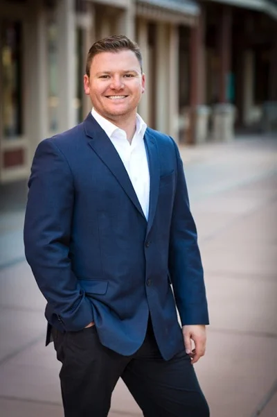 Derrik Carlson, Park City Realtor, standing in historic Main Street