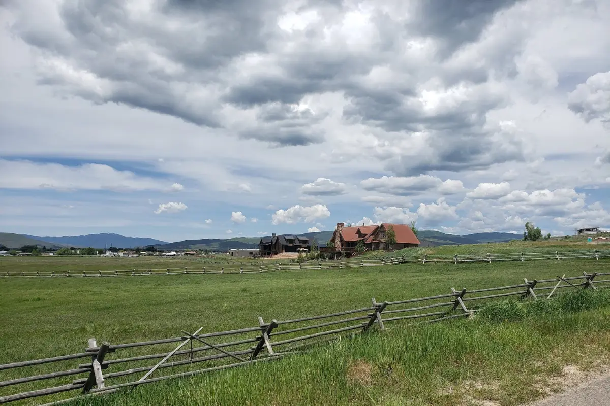 Kamas Utah home with open field acreage and mountain backdrop