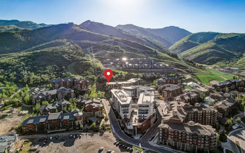 Lift Condominiums location in Canyons Village in summer with the pool deck and mountain setting