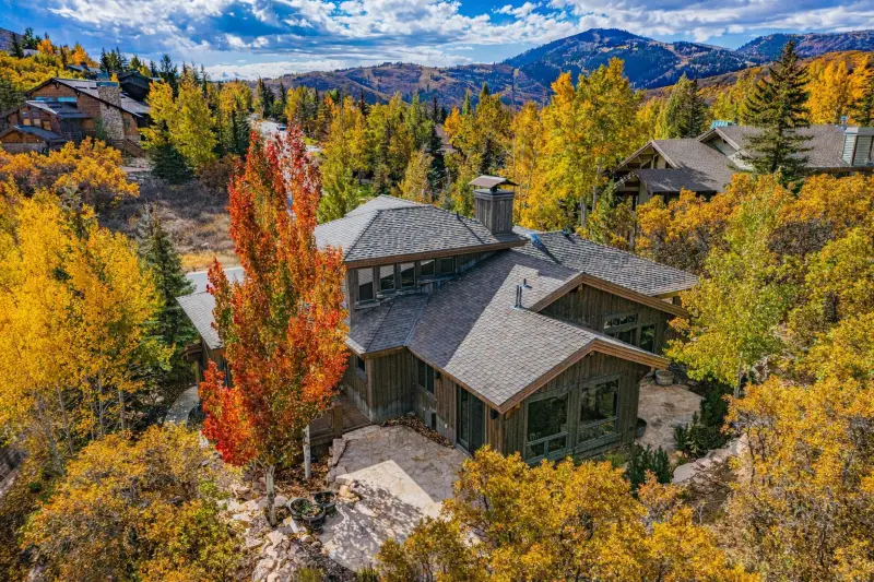 Luxury mountain home in Lower Deer Valley surrounded by fall foliage and alpine views in Park City Utah