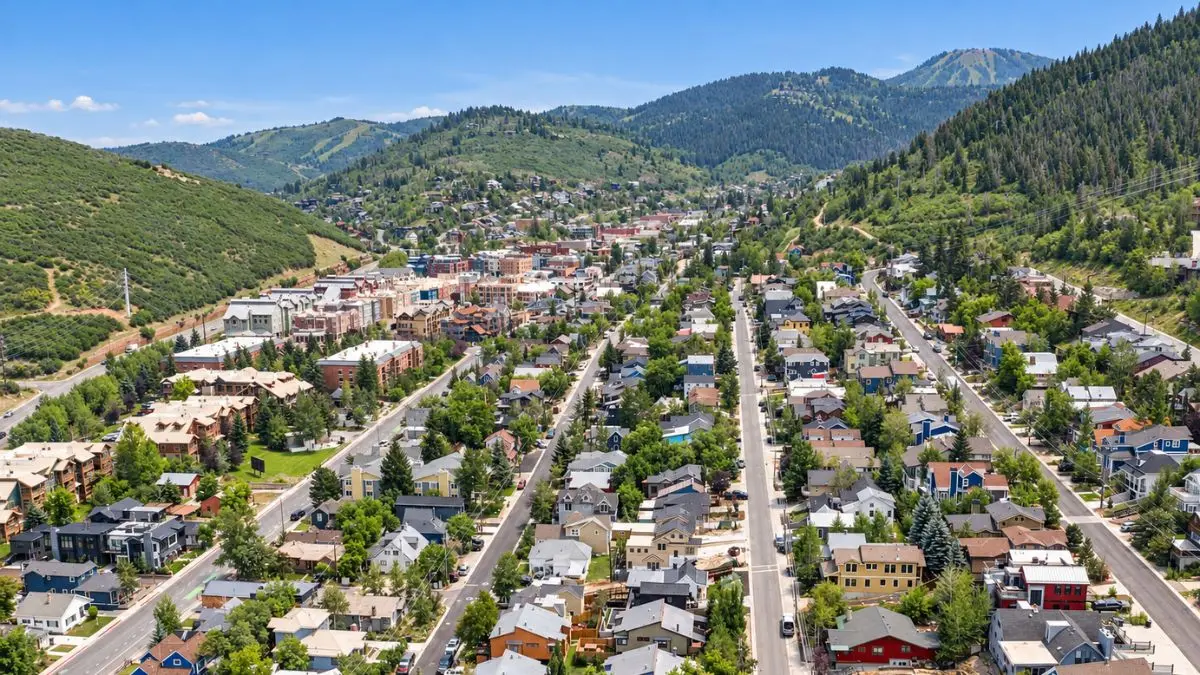 Aerial view of Old Town Park City, UT, with historic homes along Main Street and Park City Mountain rising behind