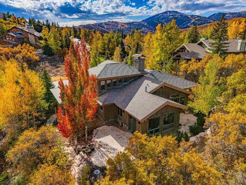 Aerial view of a Park City Utah luxury home surrounded by fall foliage