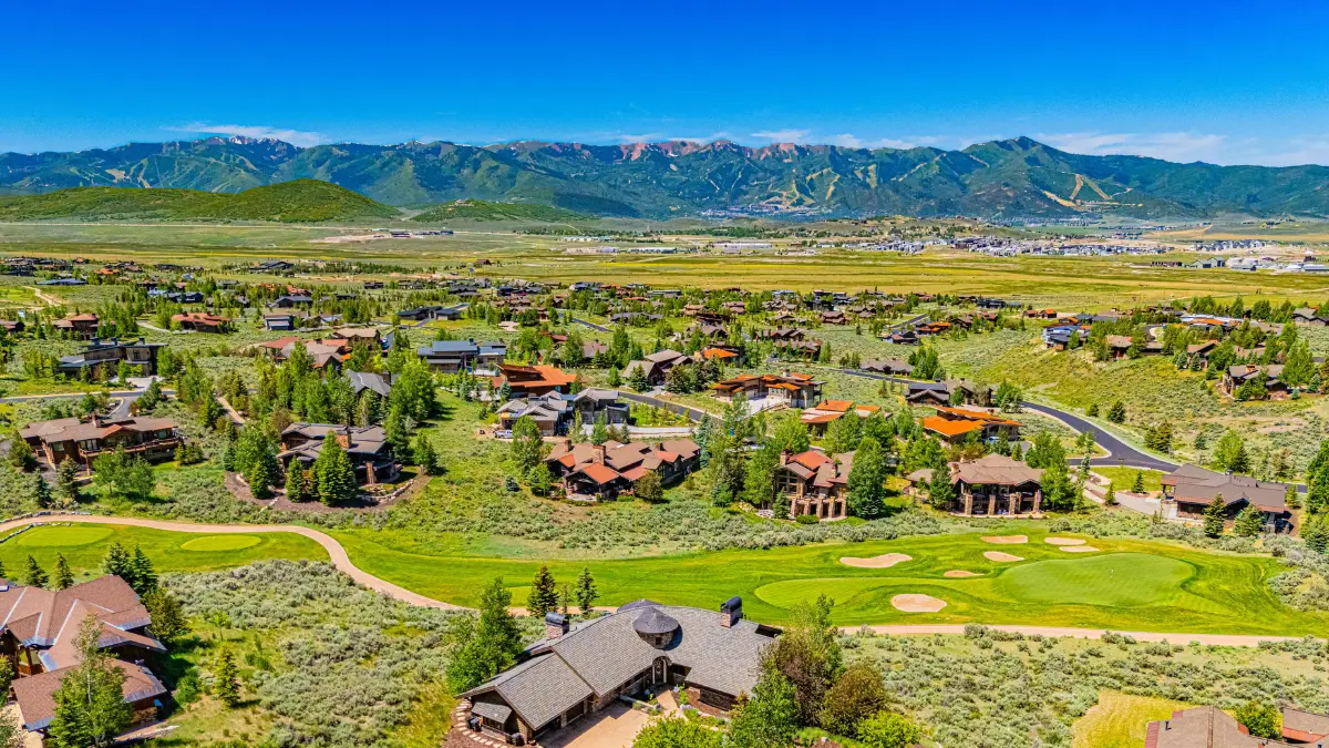 Aerial view of Promontory Club Park City Utah showing neighborhoods golf courses and mountain terrain