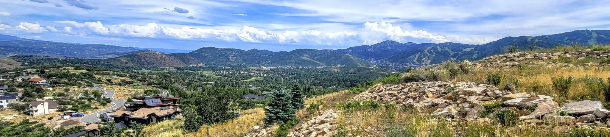 Panoramic view of Park City, Utah taken while showing property to a real estate buyer, featuring mountain scenery and residential neighborhoods